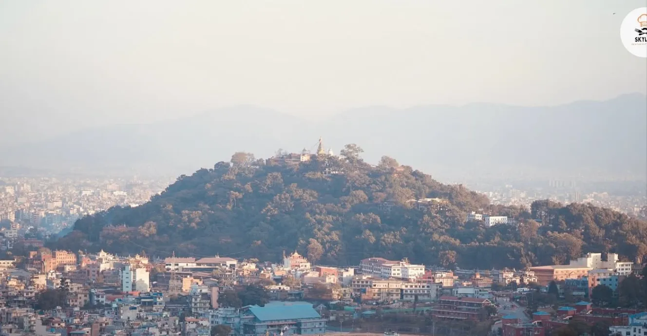 Daytime panorama of the Kathmandu Valley with a temple-topped hill