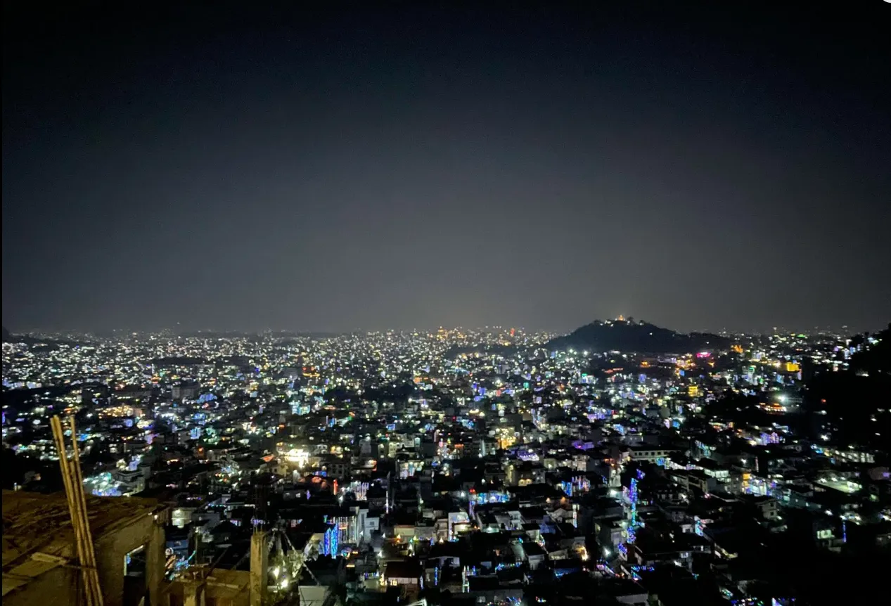The Kathmandu Valley at night, a vast field of city lights seen from Skyline on Single Tree Hill